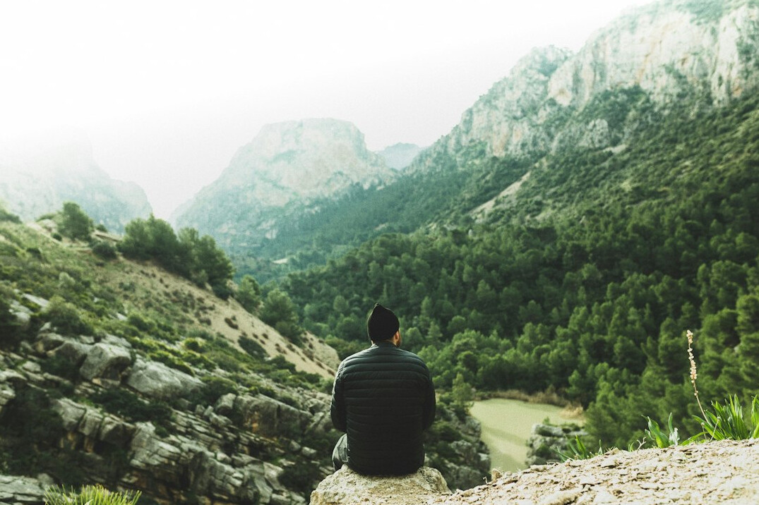 person meditating in nature