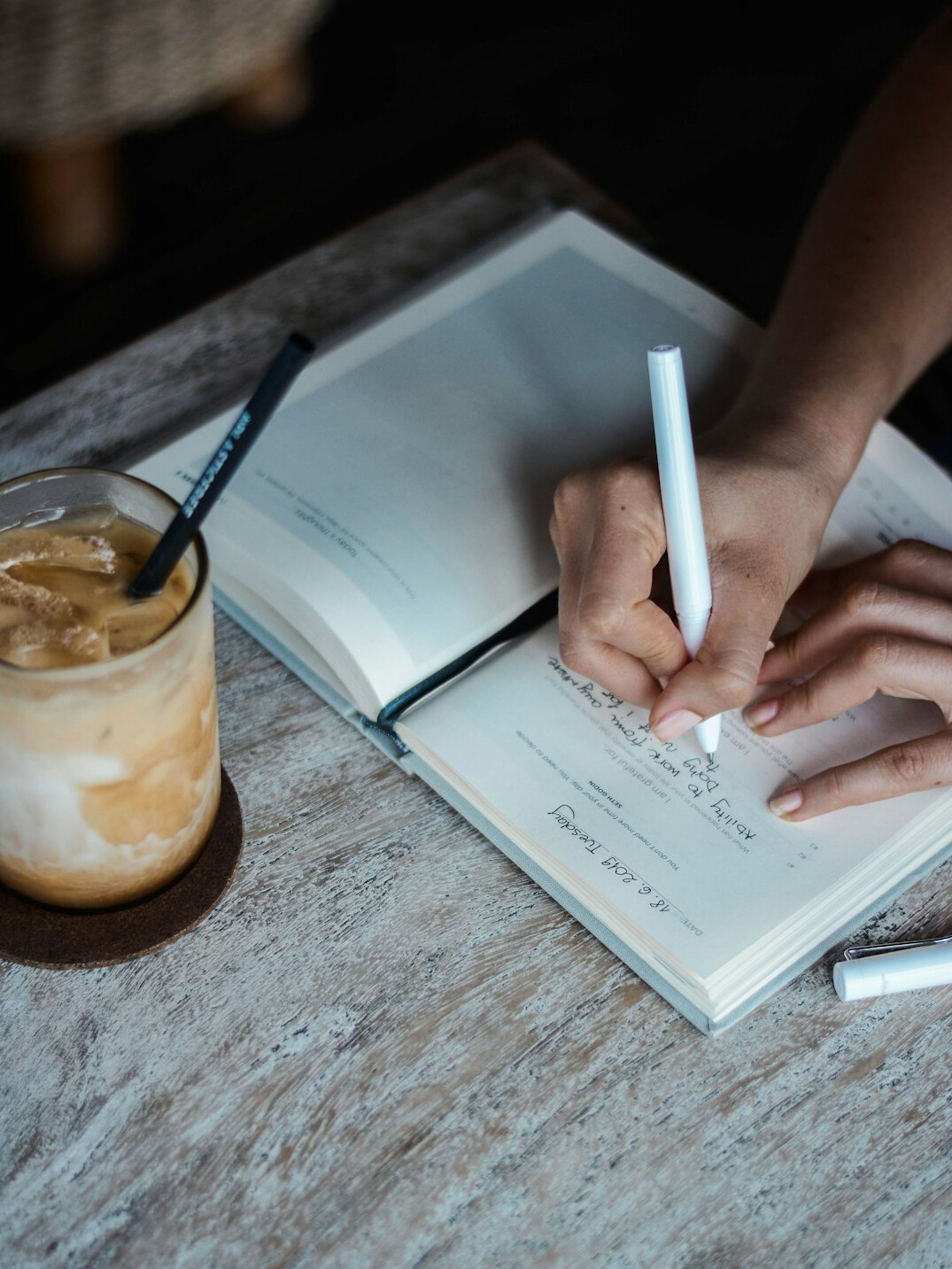 woman writing in journal